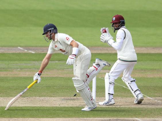 Joe Root is run out by Roston Chase, not pictured (Getty)