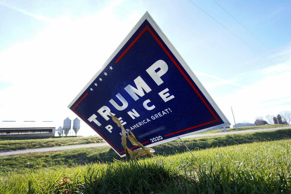 A sign in support of President Donald Trump is seen in the yard of Jasper County Republican Party chairman Thad Nearmyer, Thursday, Nov. 19, 2020, near Monroe, Iowa. "It's the Trump factor," Nearmyer said about how Democrats lost House seats. "People were super excited to vote for the president." (AP Photo/Charlie Neibergall)