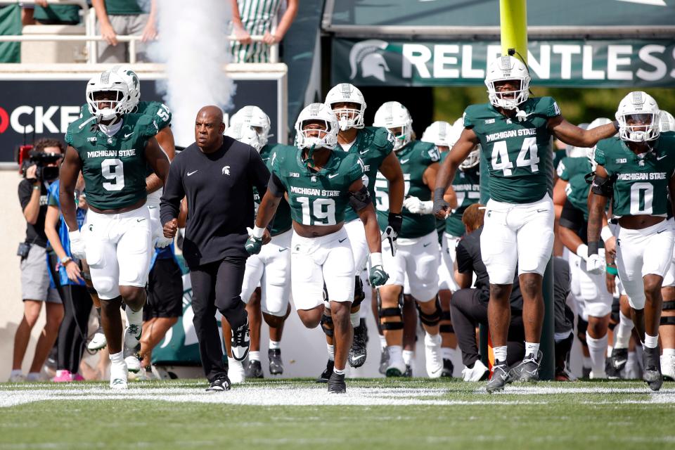 Michigan State coach Mel Tucker leads his team onto the field before an NCAA college football game against Richmond on Sept. 9.