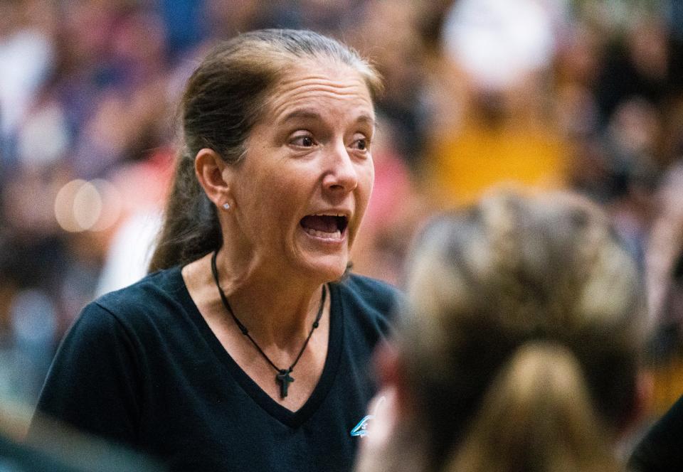 Gulf Coast's head coach Christy Wright speaks to the team during the Barron Collier and Gulf Coast high school volleyball game at Gulf Coast High School in Naples, Fla., on Oct. 5, 2021.