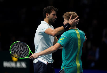 Tennis - ATP World Tour Finals - The O2 Arena, London, Britain - November 19, 2017 Bulgaria's Grigor Dimitrov with Belgium's David Goffin after winning the final Action Images via Reuters/Tony O'Brien