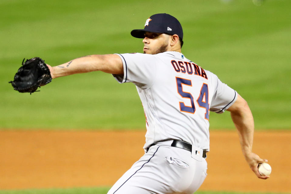 WASHINGTON, DC - OCTOBER 25:  Roberto Osuna #54 of the Houston Astros pitches against the Washington Nationals during Game 3 of the 2019 World Series at Nationals Park on Friday, October 25, 2019 in Washington, District of Columbia. (Photo by Adam Glanzman/MLB Photos via Getty Images)