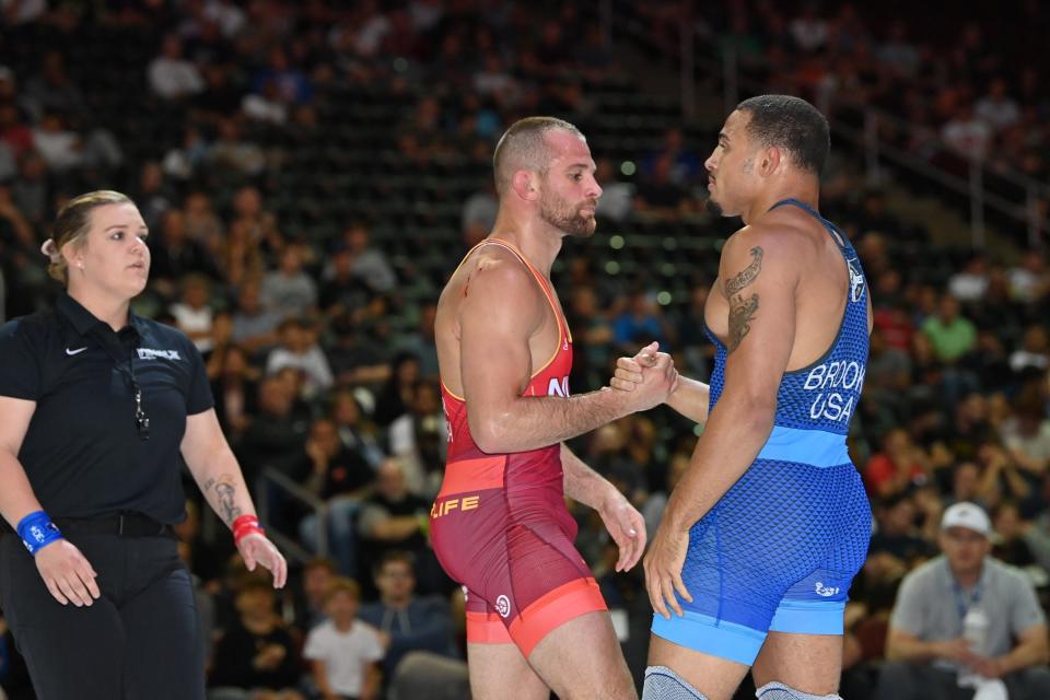 Aaron Brooks, right, and David Taylor shake hands after their first bout at Final X on Saturday in Newark, N.J.