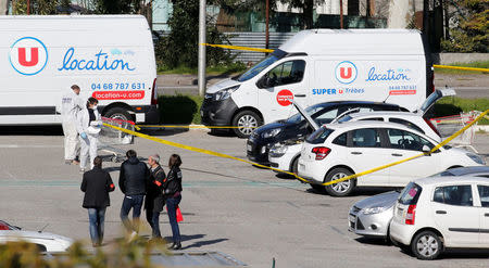 A general view shows police officers and investigators at a supermarket after a hostage situation in Trebes, France, March 23, 2018. REUTERS/Regis Duvignau