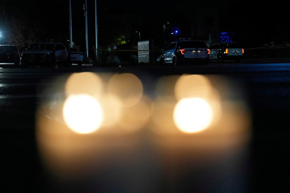 Candles left in memory of shooting victims sit near an entrance in the aftermath of a shooting (Copyright 2023 The Associated Press. All rights reserved.)