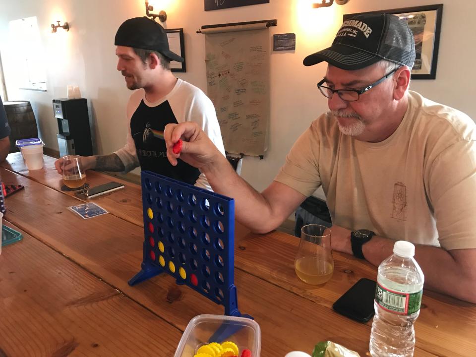 Keith Paladino of Lodi, and Gary Moyer of Maywood, play Connect 4 at the Alementary Brewing Co. in Hackensack