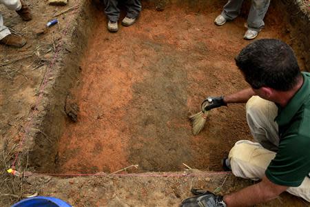 A team of anthropologists from the University of South Florida are exhuming suspected graves at the Boot Hill cemetery at the now closed Arthur G. Dozier School for Boys in Marianna, Florida, August 31, 2013. REUTERS/Edmund D Fountain/Pool