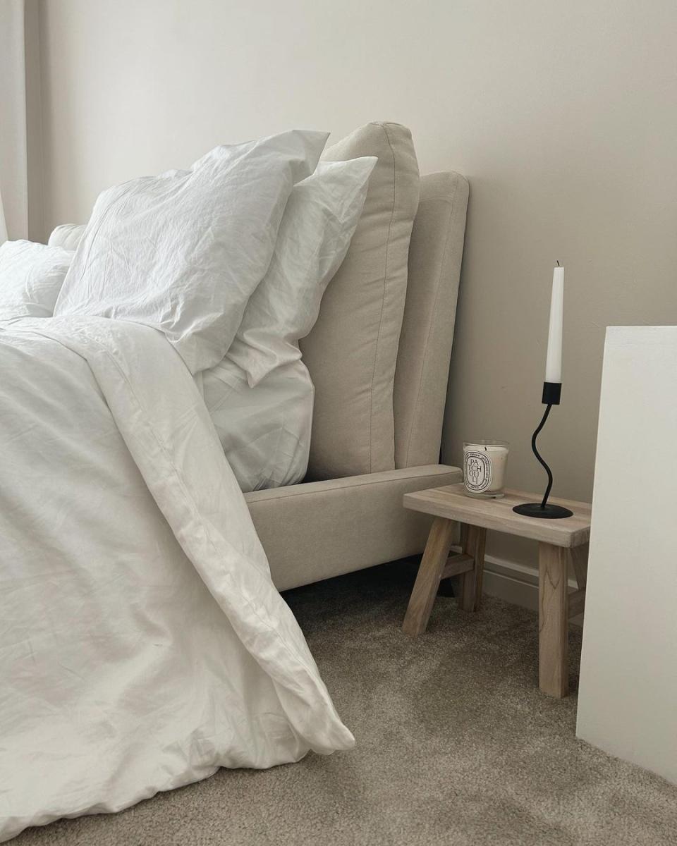 Minimal bed with small nightstand and lamp