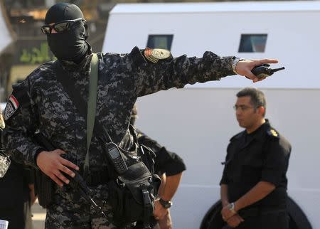 Riot police takes position during clashes with supporters of Muslim Brotherhood and ousted Egyptian President Mohamed Mursi in the Cairo suburb of Matariya November 28, 2014. REUTERS/Mohamed Abd El Ghany