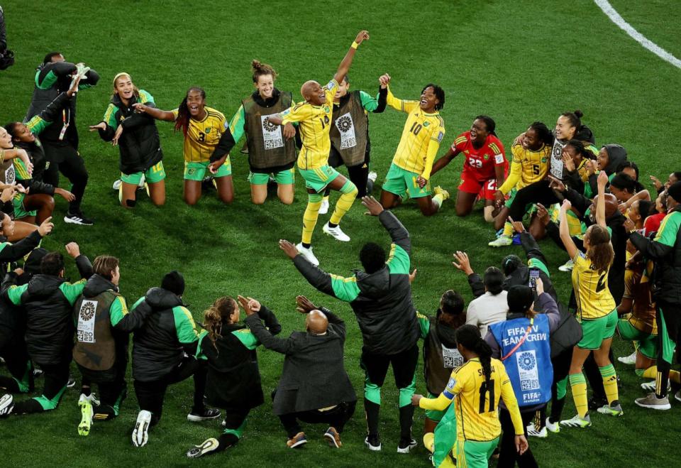 PHOTO: Jamaica's Deneisha Blackwood celebrates with teammates after the match as Jamaica qualify for the knockout stages of the World Cup Jamaica players pose for a team group photo before the match in Melbourne Rectangular Stadium, Melbourne, Australia, (Asanka Brendon Ratnayake/Reuters)
