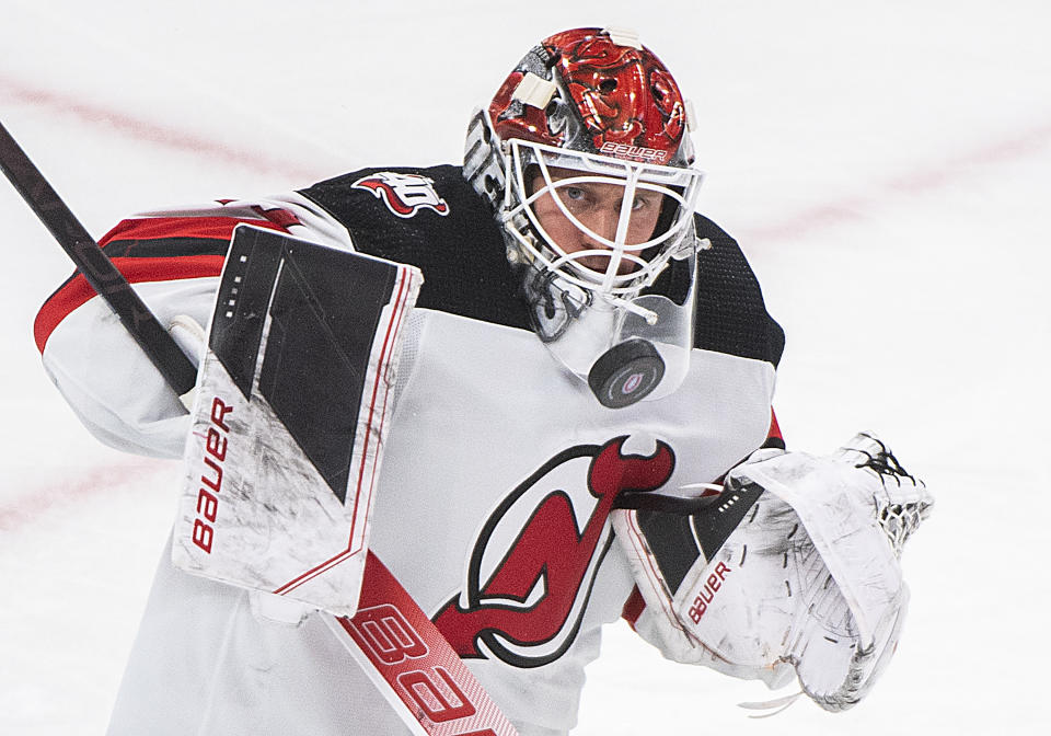 New Jersey Devils goaltender Vitek Vanecek makes a save against the Montreal Canadiens during the third period of an NHL hockey game, Tuesday, Nov. 15, 2022 in Montreal. (Graham Hughes/The Canadian Press via AP)