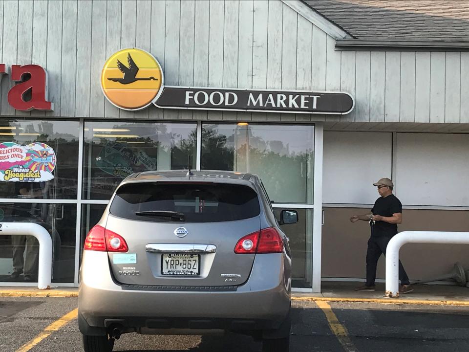 A legacy Wawa at Route 70 and Kingston Drive in Cherry HIll retains the words "food market" as part of its original front entrance signage