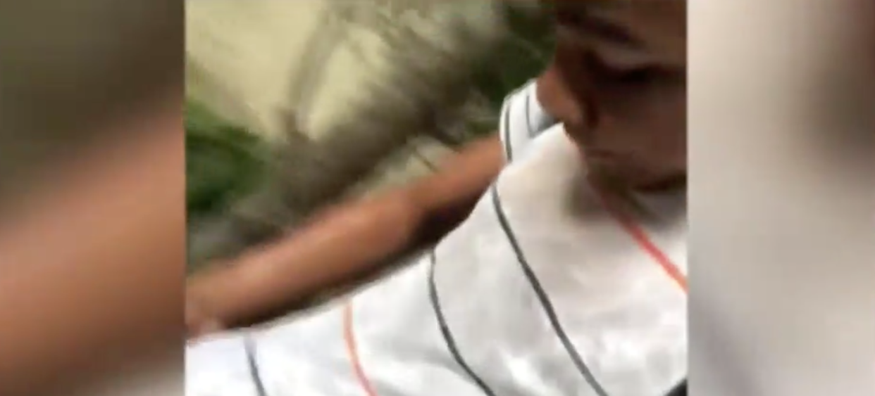 Elijah Walker captured a neighbor spraying water on him from her home for playing his music too loud on his way home from school. (Photo: KTVU)