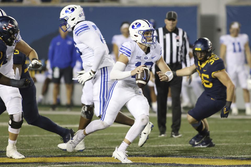 BYU Quarterback Jake Retzlaff (12) looks to pass during the second half of an NCAA college football game against West Virginia on Saturday, Nov. 4, 2023, in Morgantown, W.Va. West Virginia won 37-7. | Chris Jackson, Associated Press