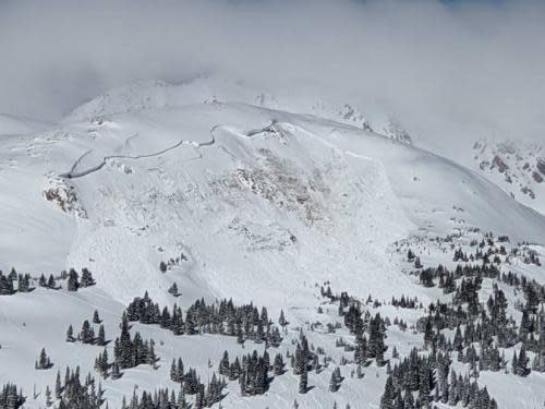 The aftermath of an avalanche that killed an unidentified snowboarder on 14 February, near the town of Winter Park in Colorado.