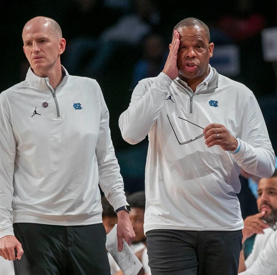 North Carolina coach Hubert Davis adjusts his glasses as Virginia Tech runs up a 20 point lead in the second half of the semi-finals of the ACC Tournament on Friday, March 11, 2022 at Barclays Center in Brooklyn, N.Y. Virginia Tech rolled to a 72-59 victory.