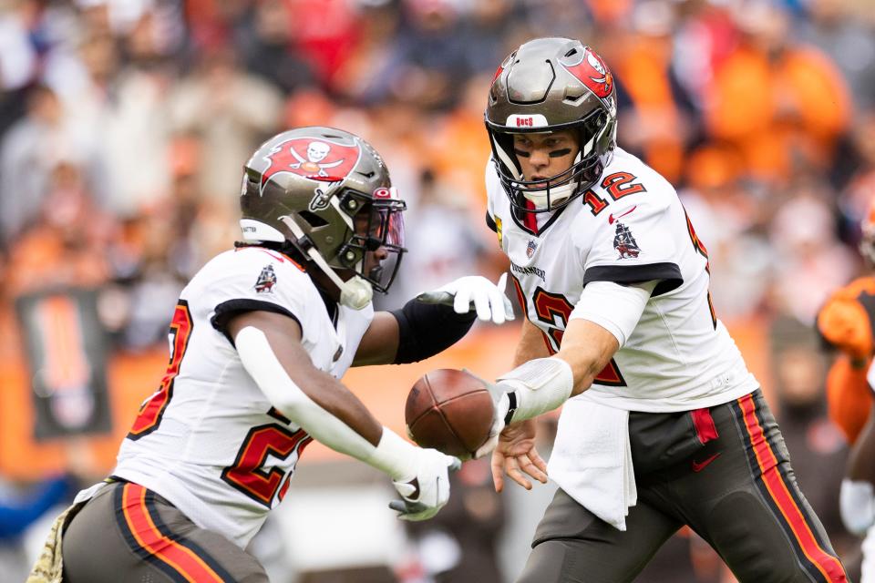 Buccaneers running back Rachaad White takes a handoff from quarterback Tom Brady in Sunday's game in Cleveland. White had a season-high 23 touches in the overtime loss.