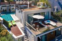 <p>We can't get enough of this dreamy villa, which is situated in the quaint little island town of Trogir.</p><p>'This seafront home comes with a heated swimming pool, a hot tub and Instagram-worthy outdoor Balinese beds and a <a href="https://www.housebeautiful.com/uk/garden/g35548498/hanging-egg-chair/" rel="nofollow noopener" target="_blank" data-ylk="slk:hanging egg chair;elm:context_link;itc:0;sec:content-canvas" class="link ">hanging egg chair</a>,' say Vrbo. 'Indoors, you will find mod cons throughout, including a fully furnished <a href="https://www.housebeautiful.com/uk/decorate/kitchen/g423/best-kitchen-design-trends/" rel="nofollow noopener" target="_blank" data-ylk="slk:kitchen;elm:context_link;itc:0;sec:content-canvas" class="link ">kitchen</a> and air con.'</p><p>This villa is available to rent via <a href="https://www.vrbo.com/en-gb/p10481628" rel="nofollow noopener" target="_blank" data-ylk="slk:Vrbo;elm:context_link;itc:0;sec:content-canvas" class="link ">Vrbo</a> for £397 per night.</p><p><a class="link " href="https://www.vrbo.com/en-gb/p10481628" rel="nofollow noopener" target="_blank" data-ylk="slk:BOOK NOW;elm:context_link;itc:0;sec:content-canvas">BOOK NOW</a><br></p>