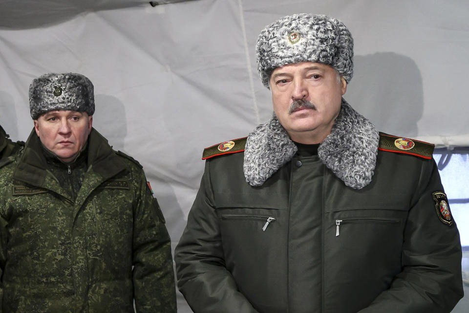 FILE - Belarusian President Alexander Lukashenko, right, and Defense Minister Viktor Khrenin attend a meeting with military top officials at the Obuz-Lesnovsky training ground, Belarus, on Jan. 6, 2023. Lukashenko said Monday Feb. 20, 2023 that the ex-Soviet nation will form a new territorial defense force amid the fighting in neighboring Ukraine. (Nikolai Petrov/BelTA Pool Photo via AP, File)