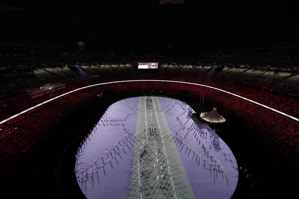 Athletes are introduced during the opening ceremony at the Olympic Stadium at the 2020 Summer Olympics, Friday, July 23, 2021, in Tokyo. (AP Photo/Morry Gash)