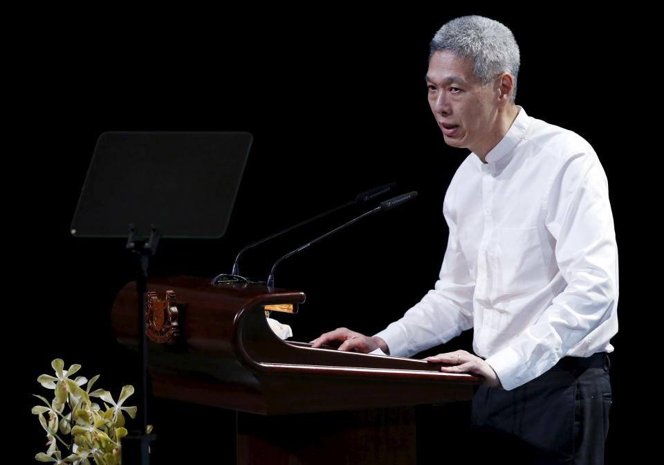 Lee Hsien Yang, son of former leader Lee Kuan Yew, delivers his eulogy during the funeral service at the University Cultural Centre at the National University of Singapore March 29, 2015. Grieving Singaporeans were joined by world leaders on Sunday to pay their final respects to the country's first prime minister, Lee Kuan Yew, as the nation came to a near-halt to honour its 