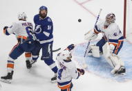 Tampa Bay Lightning's Pat Maroon (14) and New York Islanders' Andy Greene (4) look for the rebound from Islanders goalie Semyon Varlamov (40) as Islanders' Ryan Pulock (6) defends during second-period NHL Eastern Conference final playoff game action in Edmonton, Alberta, Monday, Sept. 7, 2020. (Jason Franson/The Canadian Press via AP)