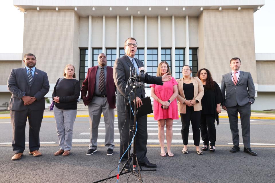 Mayor Robert Sullivan, center, and the Brockton School Committee, along with newly appointed Acting Superintendent of Schools James Cobbs, third from left, held a press conference following an emergency School Committee meeting at the Brockton High School on Friday, Sept. 1, 2023.
