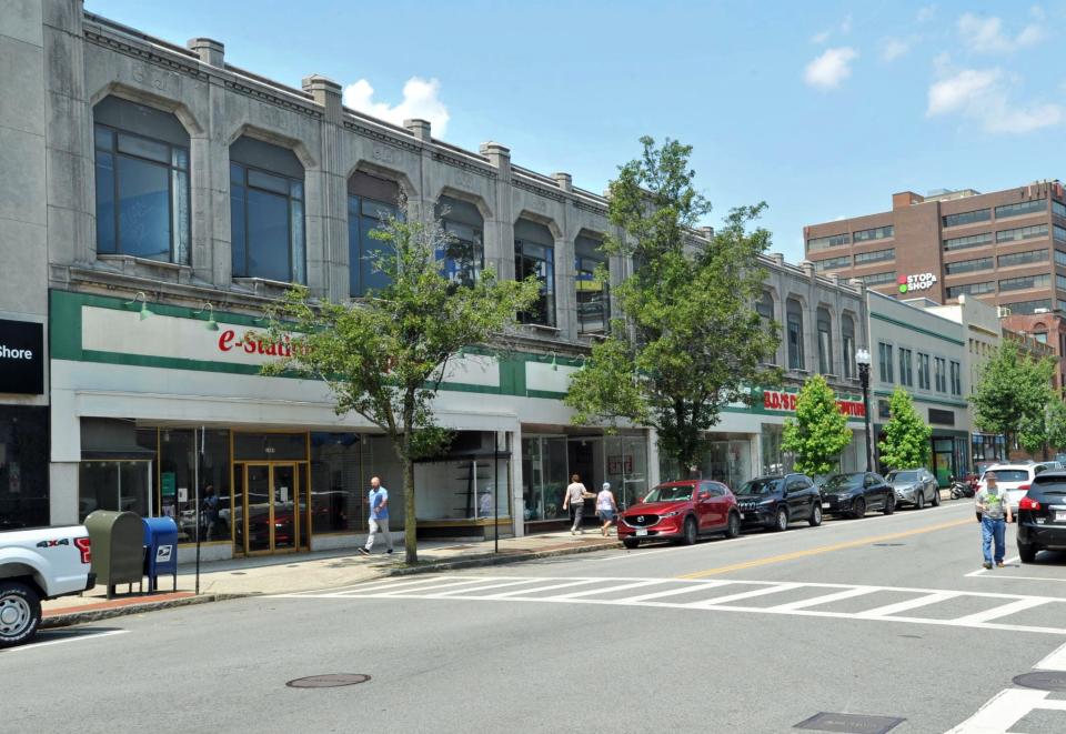 Much of this downtown Quincy block of Hancock Street is slated to be demolished and replaced with two residential towers and a small city park , Wednesday, July 12, 2023.