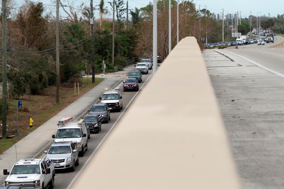 The turnoff to San Carlos Blvd. from Summerlin Rd. is backed up with drivers headed to Fort Myers Beach on Sunday, October 9, 2022. 