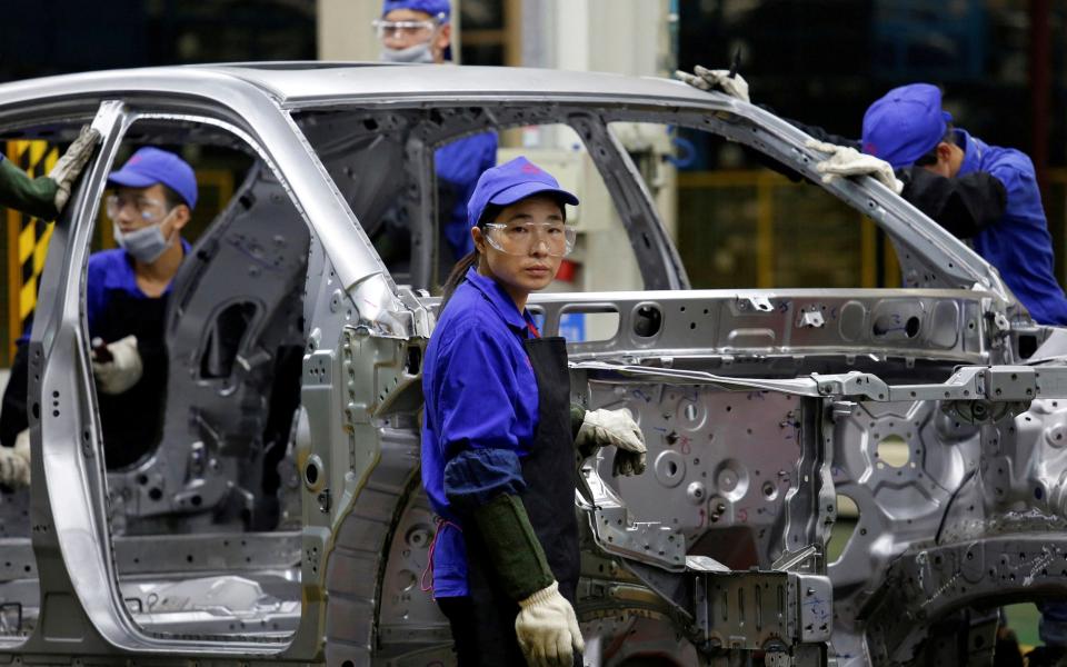 Workers at a BYD assembly line in Shenzhen, China, 2016