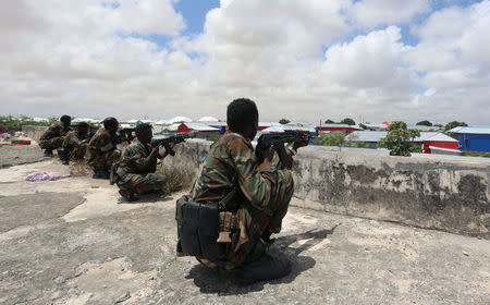 Members of Somali Armed Forces take their position during fighting between the military and police backed by intelligence forces in the Dayniile district of Mogadishu, Somalia September 16, 2017. REUTERS/Feisal Omar