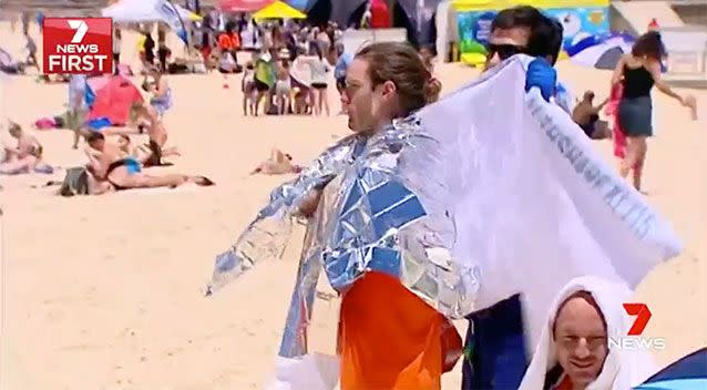 Organisers of the swim tried to cut the route down to help swimmers cope with the cold. Source: 7 News