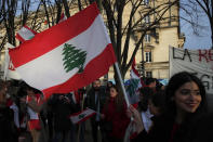 Lebanese protesters gather outside of the French foreign ministry in Paris, Wednesday, Dec. 11, 2019, to denounce a closed-door meeting of diplomats from several countries on aid to Lebanon. The Middle Eastern country is facing a political and economic crisis, and the international group is discussing conditions for global assistance to help ease Lebanon's financial woes.(AP Photo/Francois Mori)