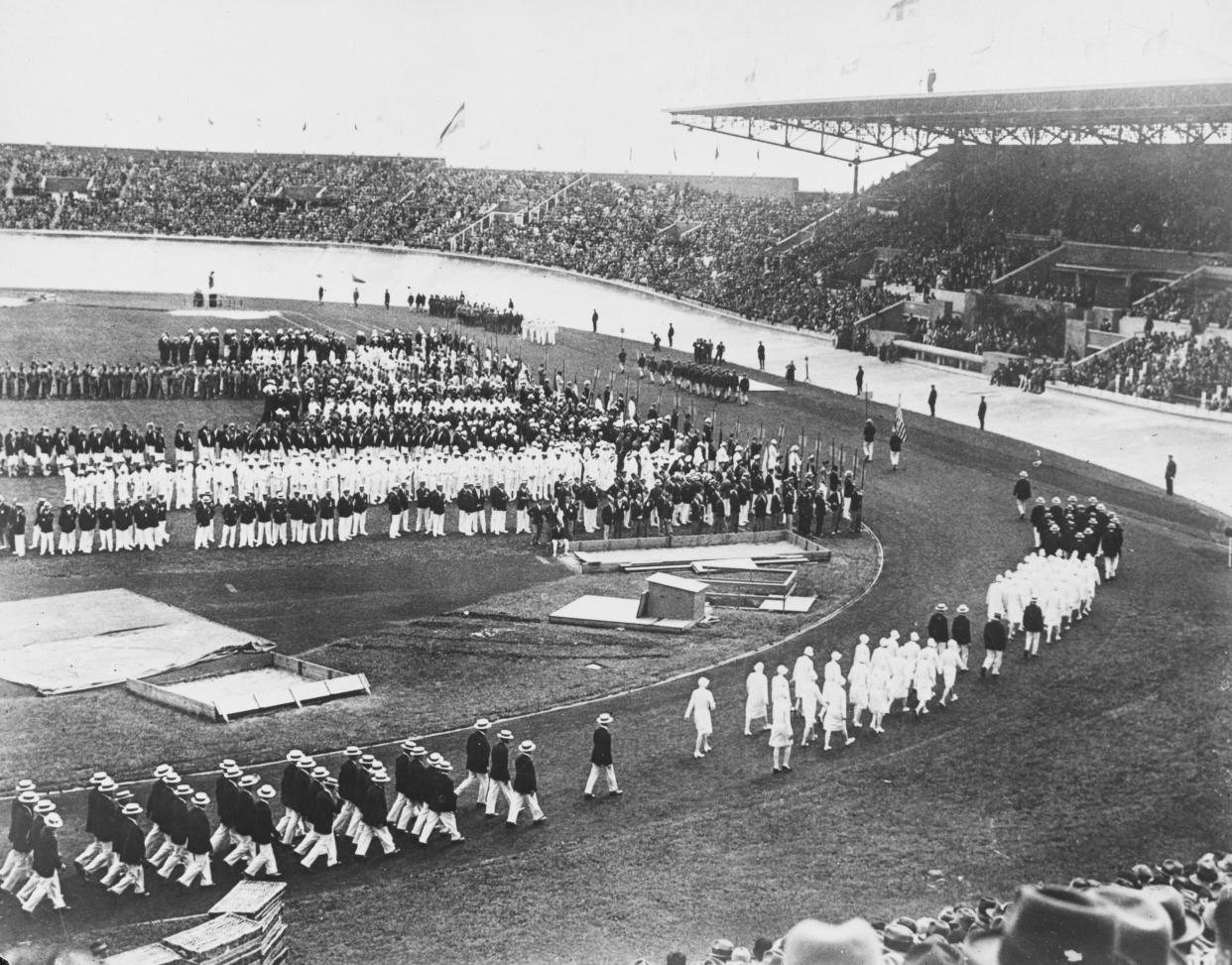 High angle view of the opening ceremony at the 1924 Summer Olympics, at the Stade olympique Yves-du-Manoir, the Olympic stadium for the 1924 Summer Olympics, in the Colombes suburb of Paris, France, July 1924. The stadium is also known as the Stade olympique de Colombes. (Photo by Keystone/Hulton Archive/Getty Images)