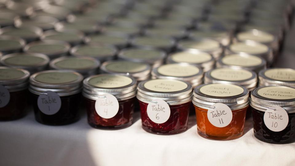 This Aug. 2, 2013 photo provided by Super9Studios.com shows homemade jam favors made by Jillian Simms for the guests at wedding of Jillian and Jason Simms. The wedding favor, that little thank-you-for-coming gift, has risen to new heights with the bride and groom giving guests a wide range of favors that are meaningful to them. (AP Photo Super9Studios.com, Irene Liebler)