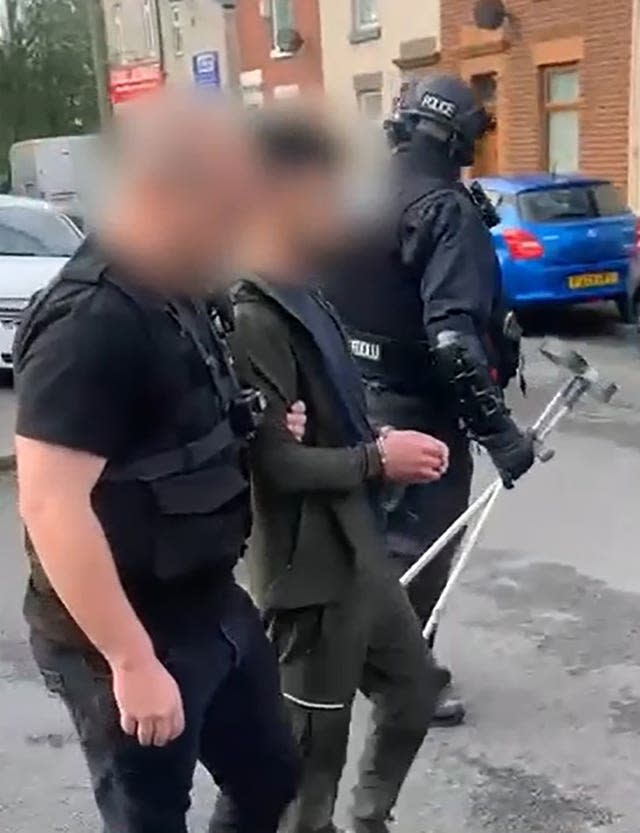 Screen grab taken from handout video issued by National Crime Agency of a 38-year-old man, who claims to be an Iraqi national, being detained on suspicion of facilitating illegal immigration to the UK