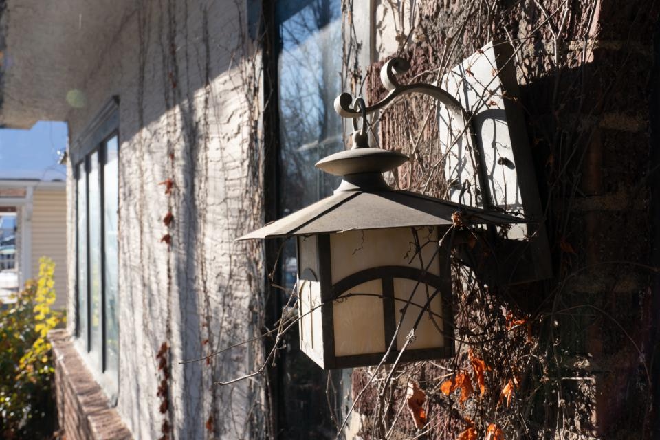 Original light fixtures still hang from the front of the Lucinda Todd home.