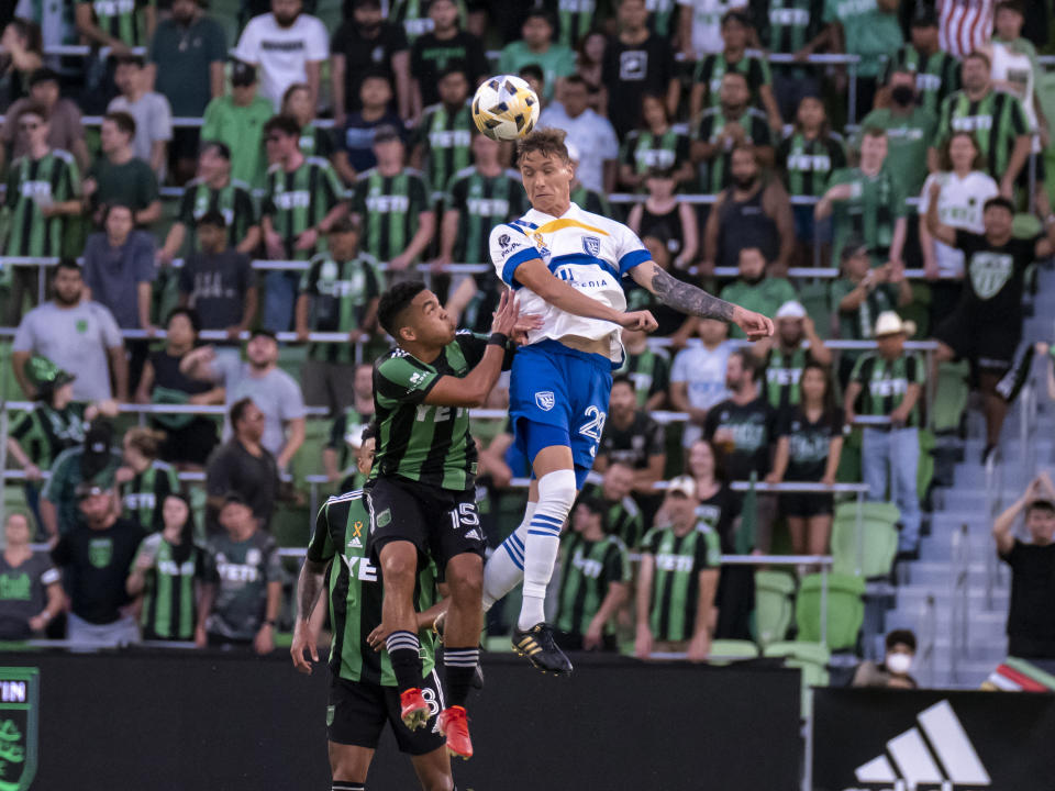 San Jose Earthquakes forward Benji Kikanovic, right, wins a header against Austin FC midfielder Daniel Pereira during the first half of an MLS soccer match Saturday, Sept. 18, 2021, in Austin, Texas. San Jose won 4-3. (AP Photo/Michael Thomas)