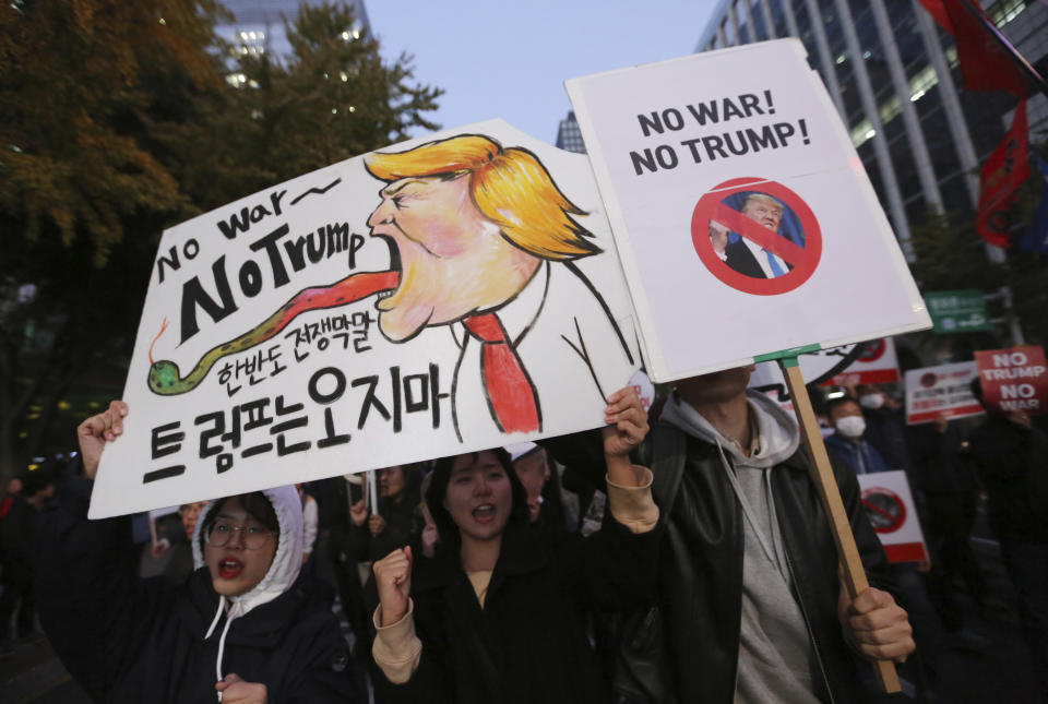 <p>Protesters march toward the U.S. Embassy during a rally to oppose a planned visit by the President Donald Trump in Seoul, South Korea, Saturday, Nov. 4, 2017. The signs read ” We oppose Trump’s visit.” (Photo: Ahn Young-joon/AP) </p>