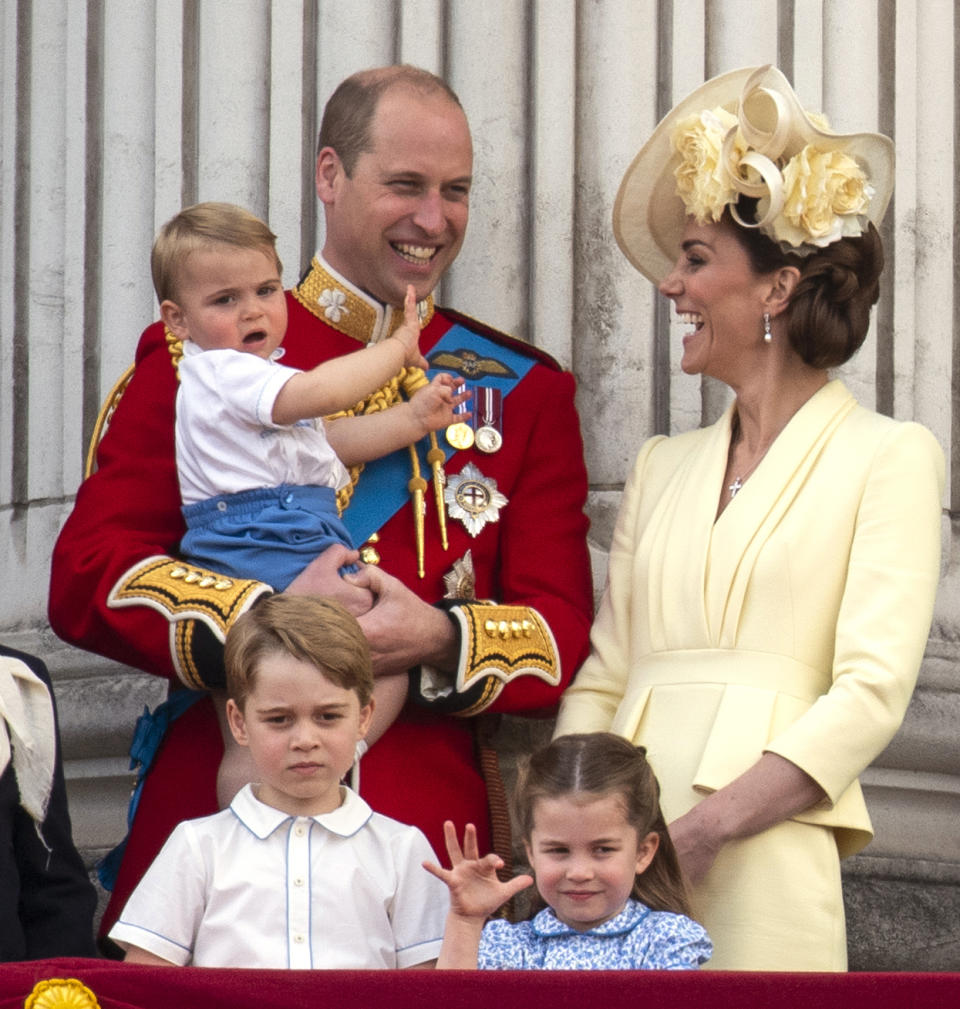 The Duke and Duchess of Cambridge with their children, Prince Louis, Prince George and Princess Charlotte, on the balcony of Buckingham Place as they watch the flypast following Trooping the Colour ceremony, as Queen Elizabeth II celebrates her official birthday. 