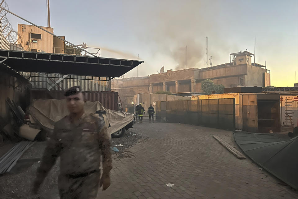 CORRECTS SECOND SENTENCE - Smoke rises from the Swedish Embassy in Baghdad Thursday, July 20, 2023. Protesters angered by the planned burning of a copy of the Quran stormed the embassy early Thursday, breaking into the compound and lighting a small fire. (AP Photo/Ali Jabar)