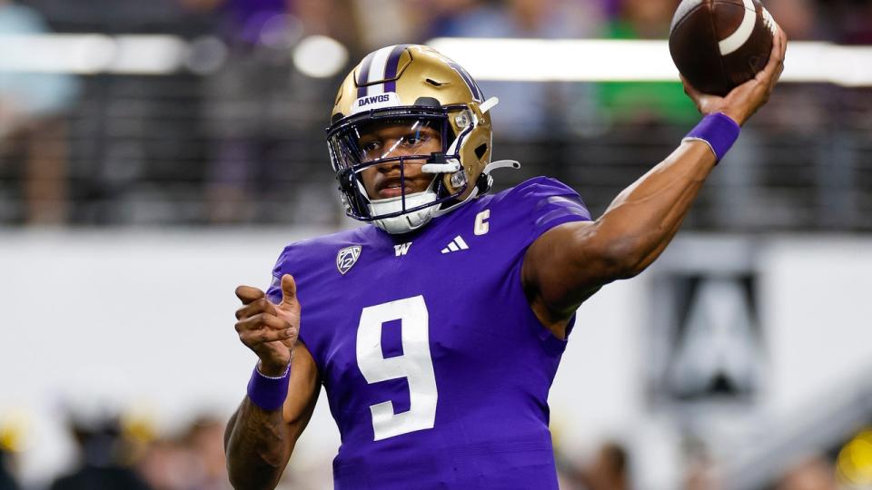 <div>LAS VEGAS, NEVADA - DECEMBER 1: Michael Penix Jr. #9 of the Washington Huskies warms up prior to the Pac-12 Championship game against the <a class="link " href="https://sports.yahoo.com/ncaaf/teams/oregon/" data-i13n="sec:content-canvas;subsec:anchor_text;elm:context_link" data-ylk="slk:Oregon Ducks;sec:content-canvas;subsec:anchor_text;elm:context_link;itc:0">Oregon Ducks</a> at Allegiant Stadium on December 1, 2023 in Las Vegas, Nevada. (Photo by Brandon Sloter/Image Of Sport/Getty Images)</div>
