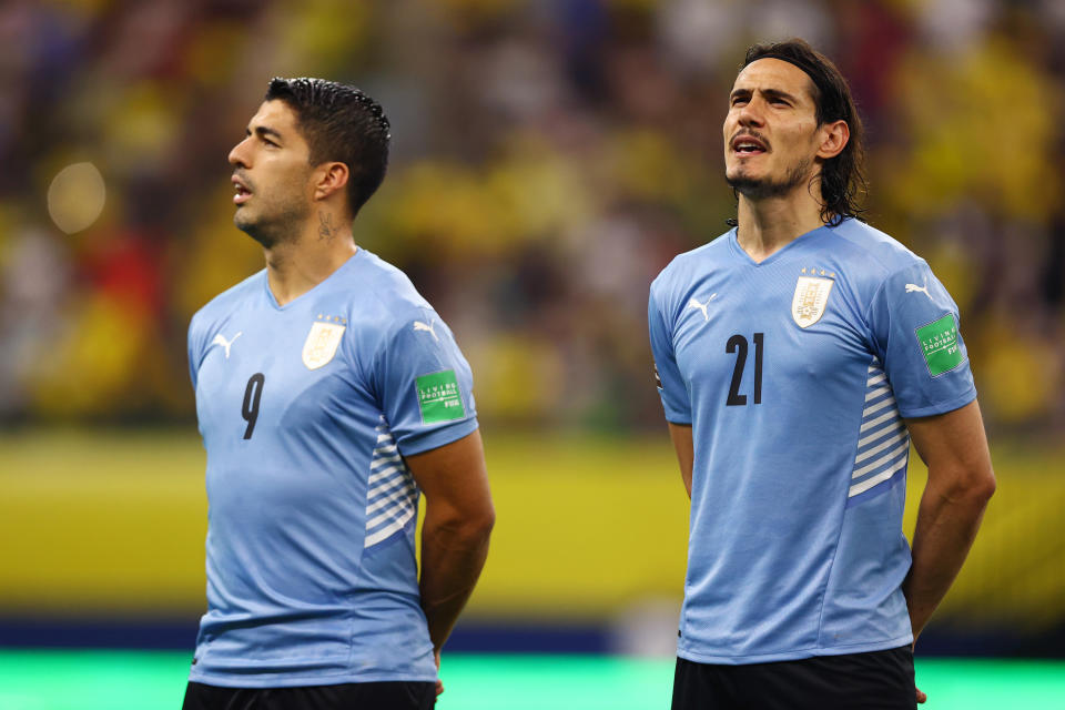 Luis Suárez and Edinson Cavani stand for national anthem