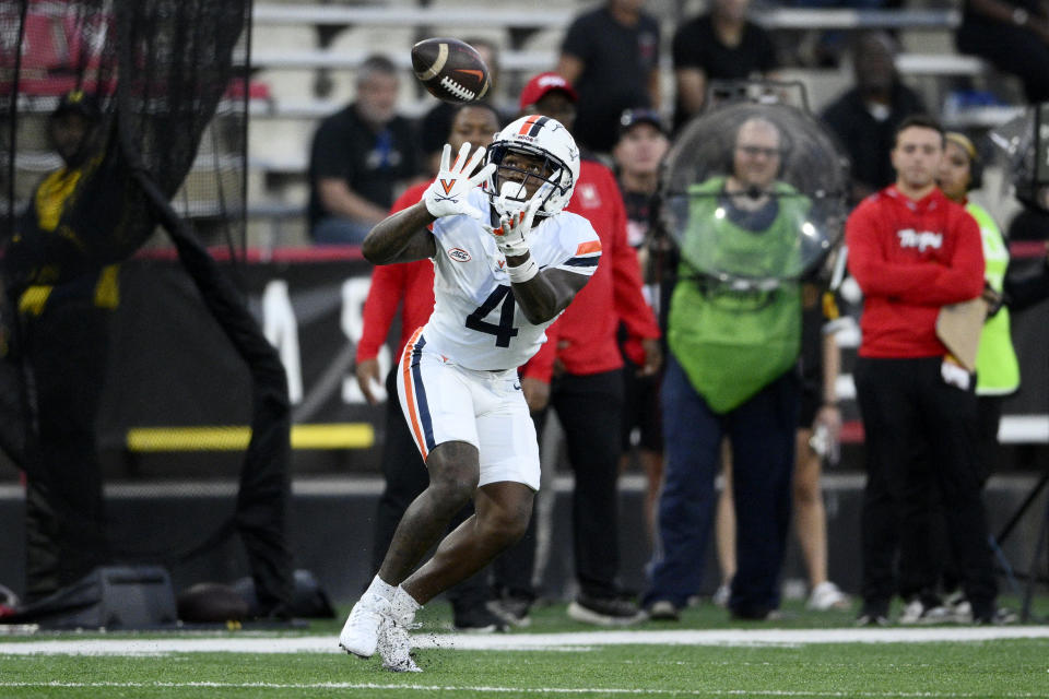 Virginia wide receiver Malik Washington makes a catch during the first half of the team's NCAA college football game against Maryland, Friday, Sept. 15, 2023, in College Park, Md. (AP Photo/Nick Wass)