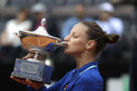 Karolina Pliskova, of the Czech Republic kisses the trophy after winning the final match against Johanna Konta at the Italian Open tennis tournament, in Rome, Sunday, May 19, 2019. Karolina Pliskova captured the biggest clay-clay-court title of her career by beating Johanna Konta 6-3, 6-4 Sunday in the Italian Open final. (AP Photo/Gregorio Borgia)