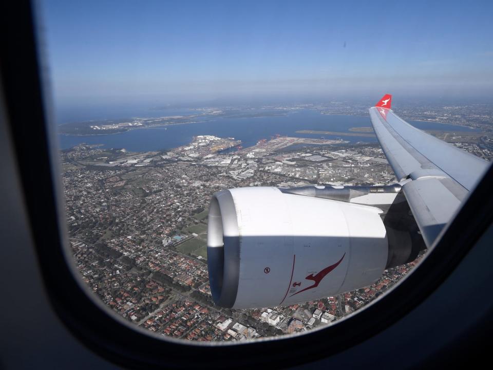 a plane engine photographed outside a window