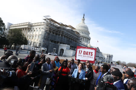 U.S. presidential candidate Senator Amy Klobuchar (D-MN) addresses Liberian activists as they rally outside of the U.S. Capitol after a day spent lobbying members of Congress for an extension of their Deferred Enforced Departure (DED) immigration status in Washington, U.S. March 14, 2019. Picture taken March 14, 2019. REUTERS/Jonathan Ernst