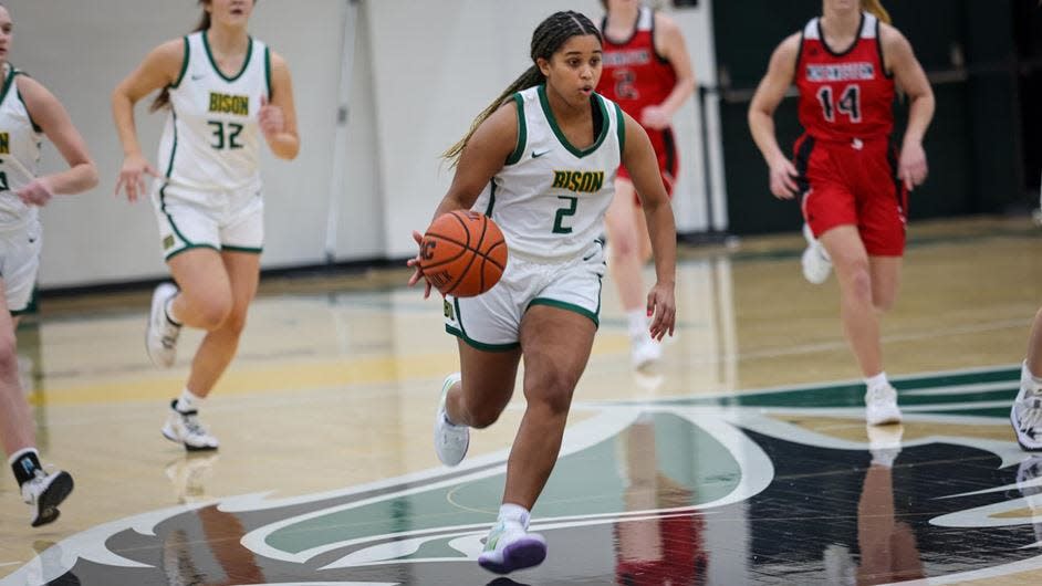 Oklahoma Baptist's Kendall Parker (2) dribbles the ball on the break Saturday at the Noble Complex.