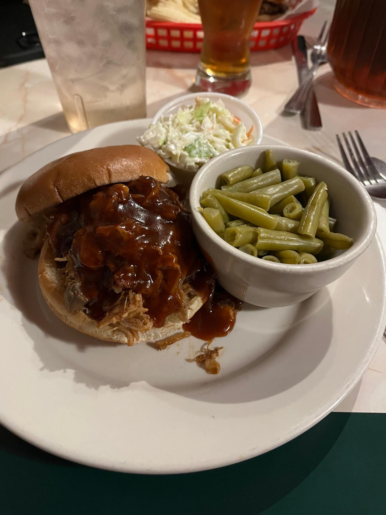 The Whisky's BBQ Sandwich at Friendly Stop Bar & Grill comes with coleslaw and a bag of chips. It costs $10.
