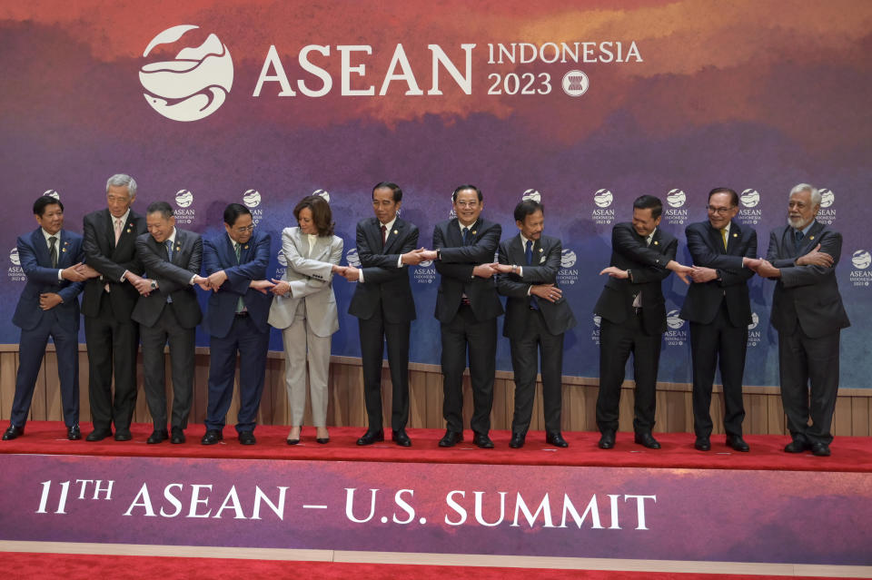 From left to right, Philippines' President Ferdinand Marcos Jr., Singapore's Prime Minister Lee Hsien Loong, Thailand's Permanent Secretary of the Ministry of Foreign Affairs Sarun Charoensuwan, Vietnam's Prime Minister Pham Minh Chinh, U.S. Vice President Kamala Harris, Indonesian President Joko Widodo, Laos' Prime Minister Sonexay Siphandone, Brunei's Sultan Hassanal Bolkiah, Cambodia's Prime Minister Hun Manet, Malaysian Prime Minister Anwar Ibrahim and East Timor's Prime Minister Xanana Gusmao hold hands as they pose for a family photo during the Association of the Southeast Asian Nations (ASEAN)-U.S. Summit in Jakarta, Indonesia, Wednesday, Sept. 6, 2023. (Bay Ismoyo/Pool Photo via AP)